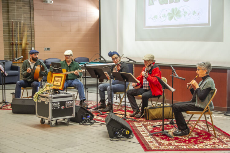 Local Celtic band Failte plays in Bay Cafe on the community college's Escanaba campus on Tuesday for a special, belated St. Patrick's Day edition of "Lunchtime Live," a music series that will be hosted by Bay College over the summer. Seen performing from left to right are Carol Irving – Penny Whistle • Bruce Irving – Guitar • Bob Yin – Fiddle • Rachelle St. John – Fiddle • Trevor St. John • Katie Bender-Fiddle(R. R. Branstrom)